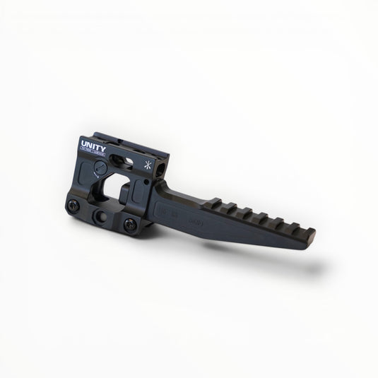 Black Unity brand firearm component on a white background